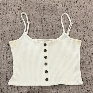 A dressy white tank top. Has a little discoloration around the underarm area.